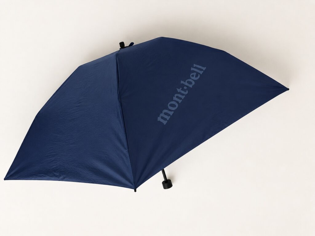 Navy Montbell ultra-light folding umbrella opened