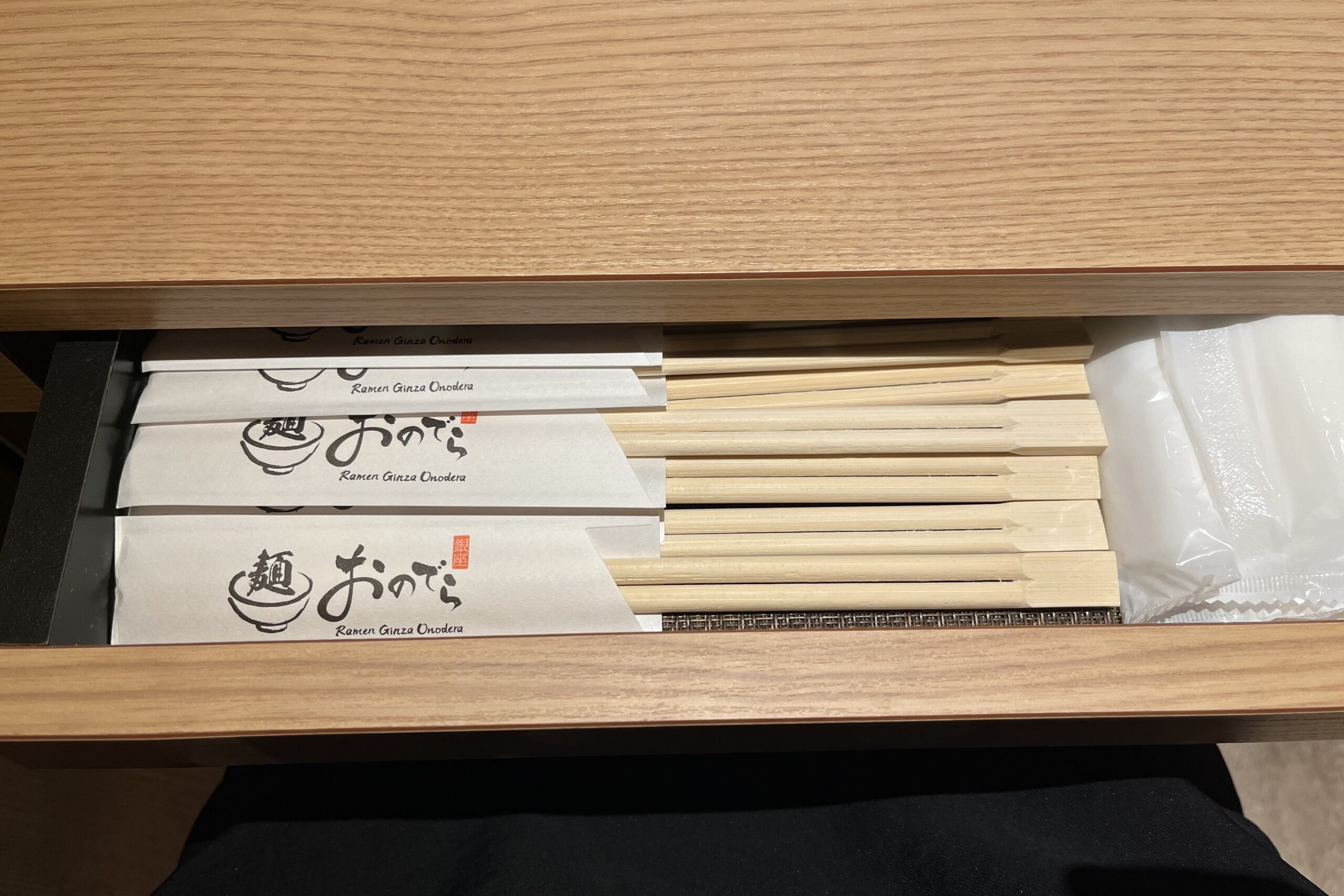 Hidden chopsticks drawer at each table